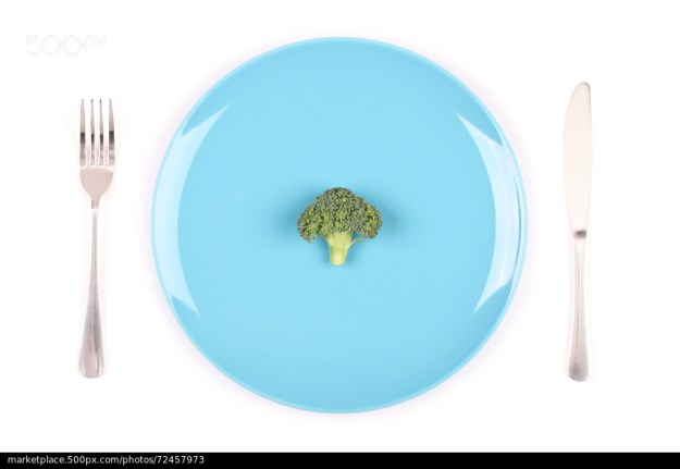 500px Photo ID: 72457973 - small piece of broccoli on blue plate isolated on white background